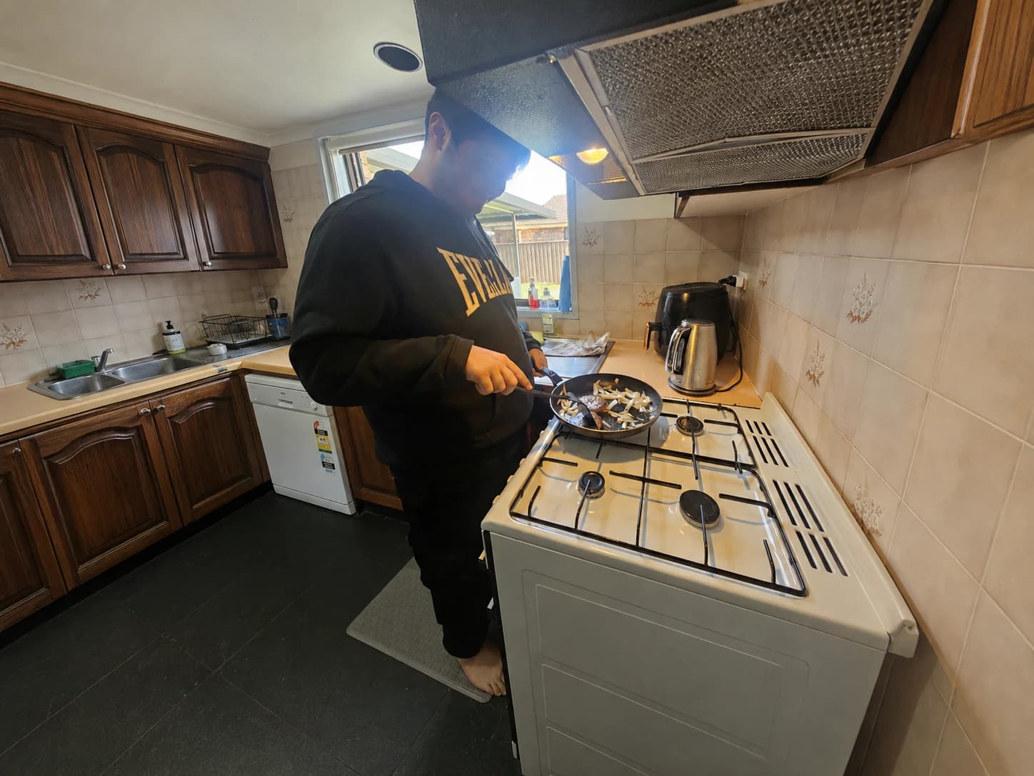 Participant practising meal preparation during everyday support