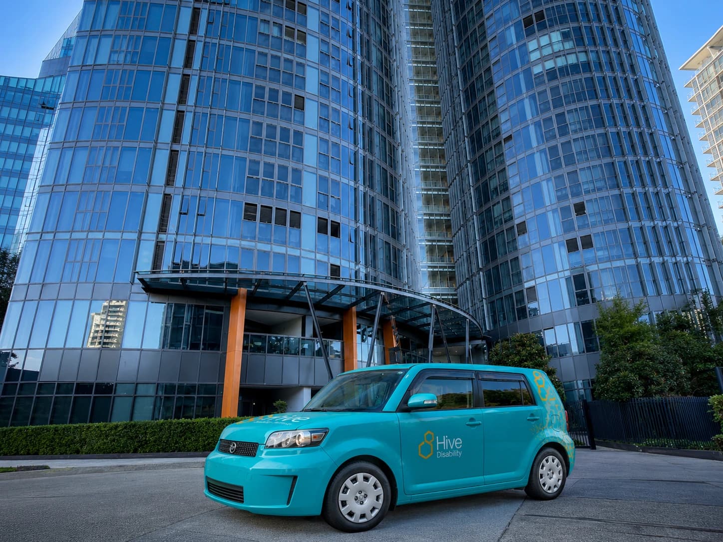 Wentworth Point SIL Apartment building entrance with the Hive Disability vehicle