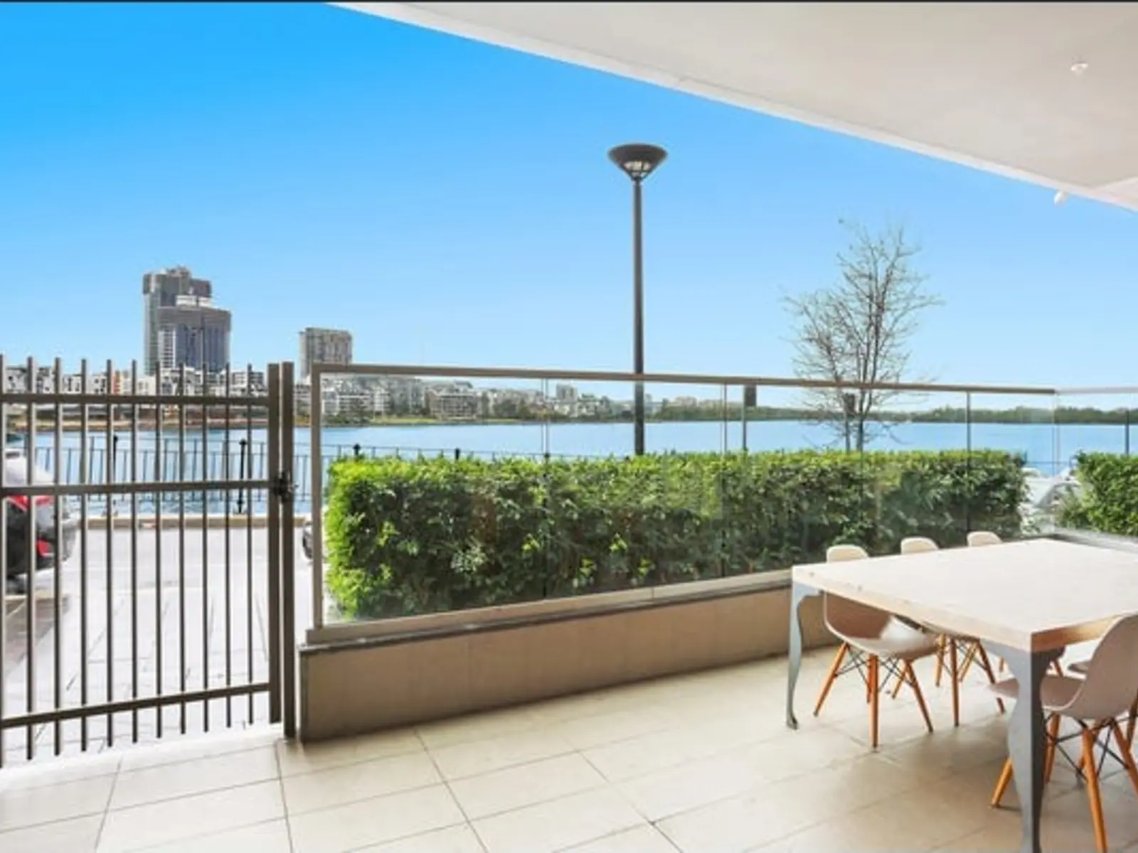 Outdoor dining area and outlook from Wentworth Point SIL Apartment 2
