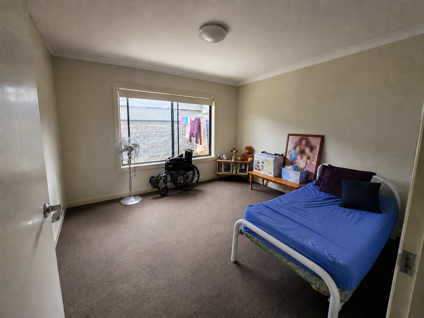 Bedroom after practical household organisation support with a clear pathway