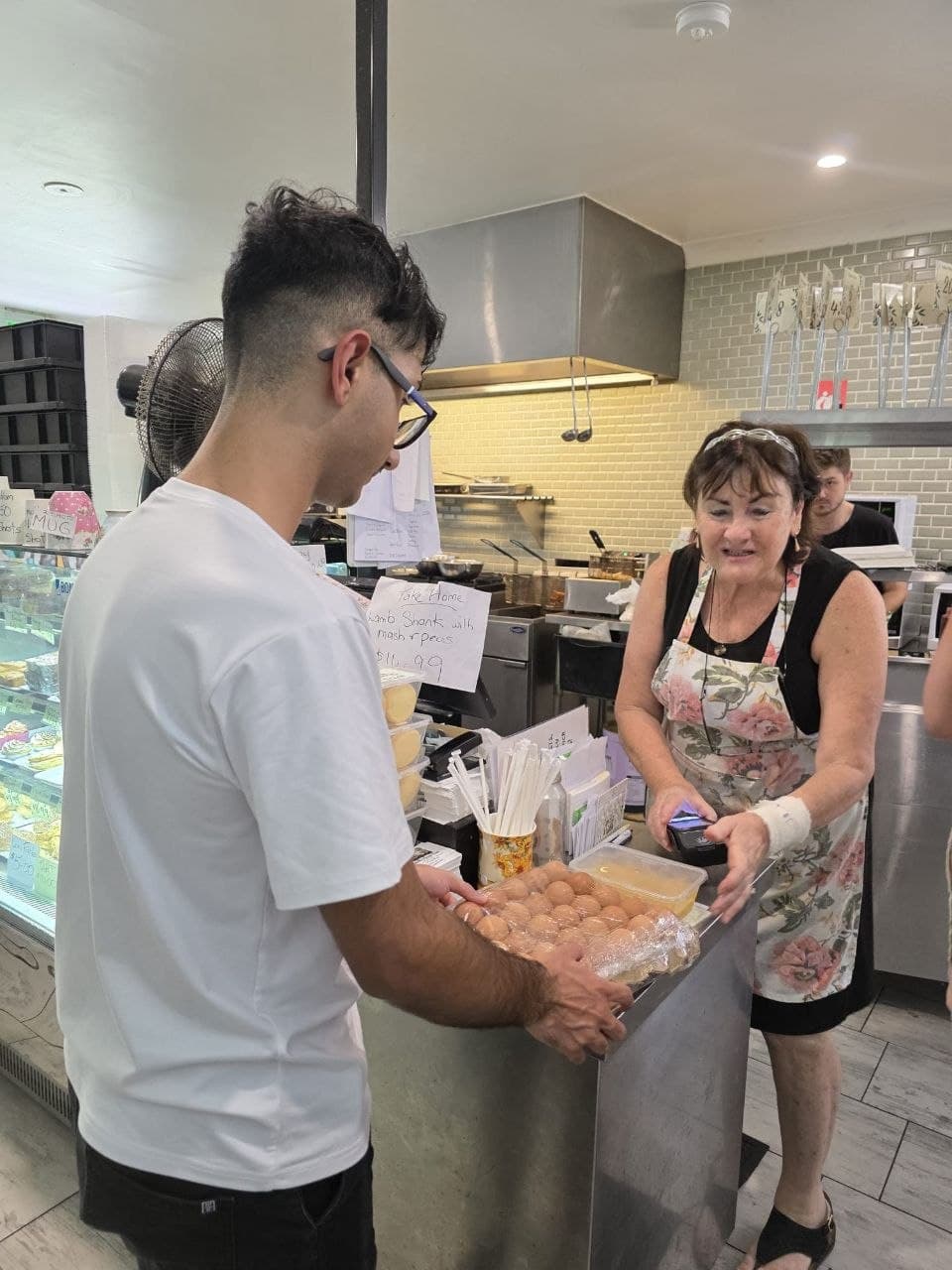 Support worker assisting with practical cooking preparation