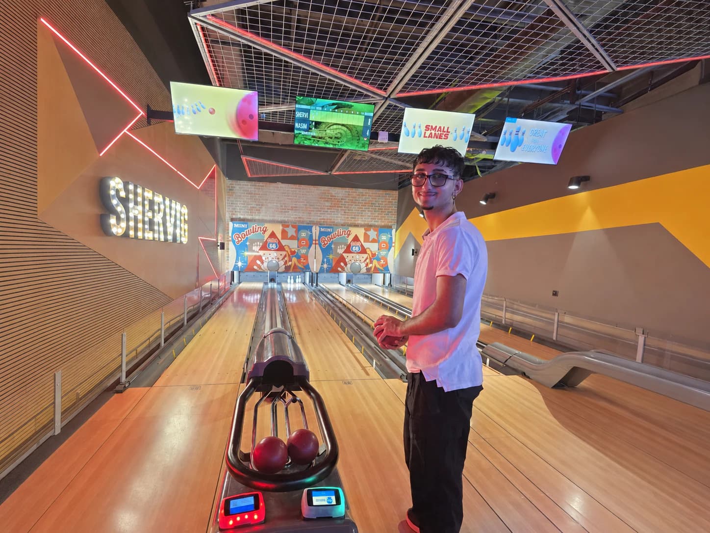 Participant enjoying a community bowling activity